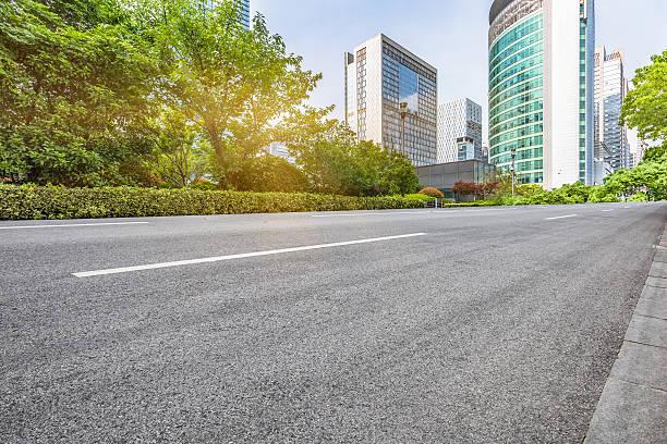 istock empty road front of modern buildings 582268900