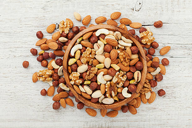 istock Mixed dried nuts. Walnut, pistachios, almonds, hazelnuts, cashews. Flat lay. 582270074
