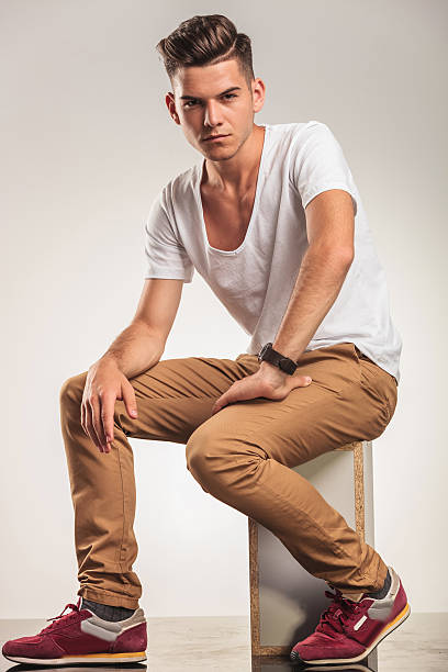 istock man looking sitting and looking at the camera 582270630