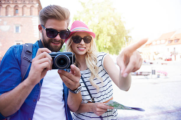 istock Young couple sightseeing old town 582270834