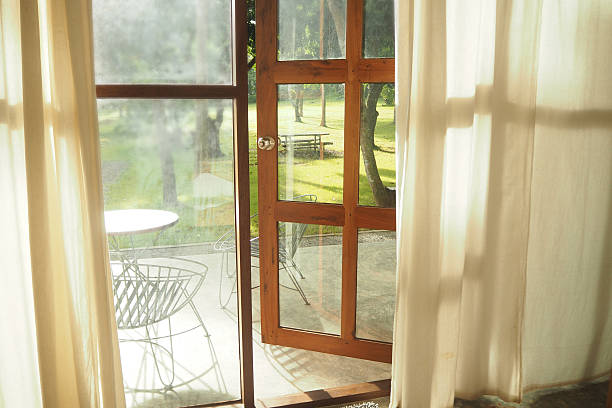 istock Garden view through an open door at morning. 582274194