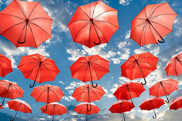 istock umbrella standing out from the crowd unique concept 582274908