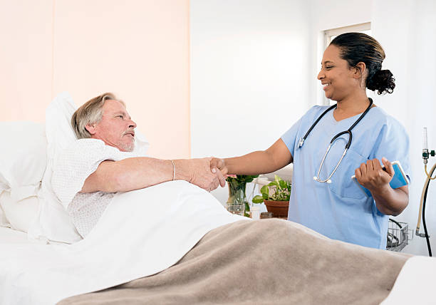 istock Senior Man In Hospital Bed 582277584