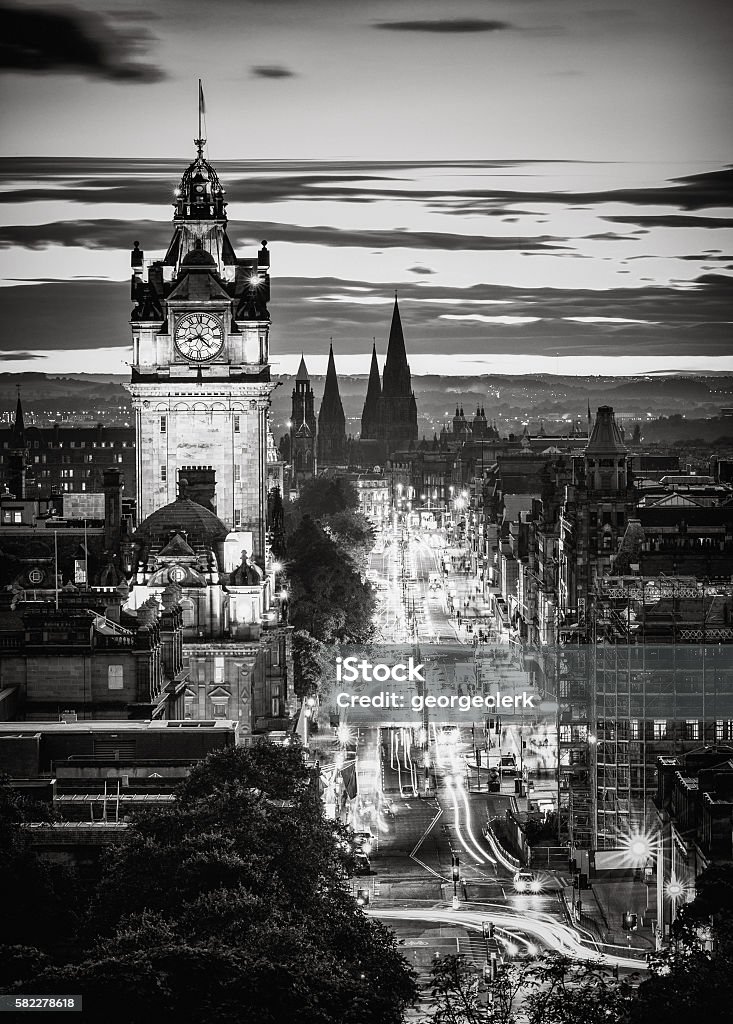 Edinburgh skyline in black and white at dusk A monochrome high-angle view along Edinburgh's Princes Street at dusk. Black And White Stock Photo