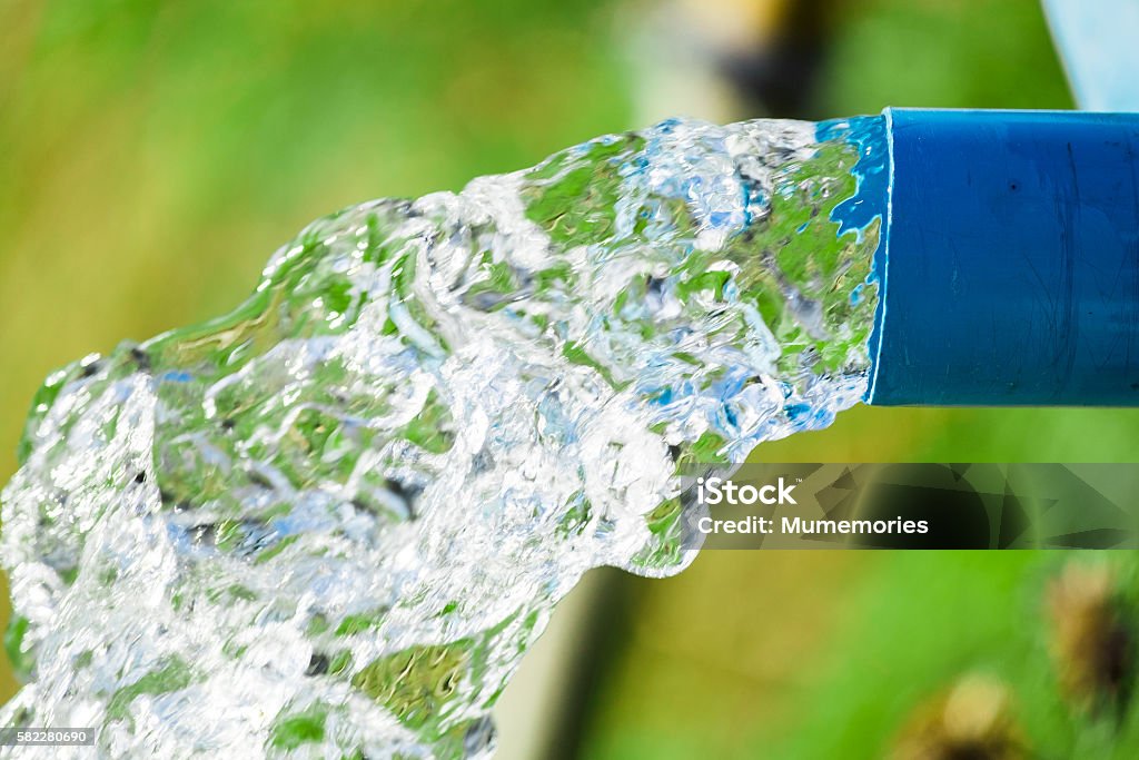 Blue pump pipe water flow equipment agriculture Water Stock Photo