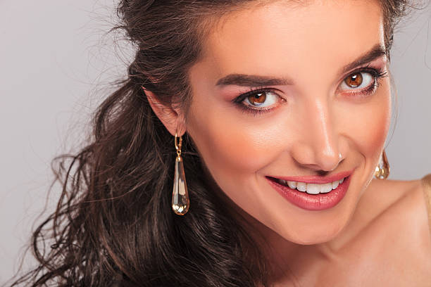 istock smiling beautiful girl wearing long earrings 582283544