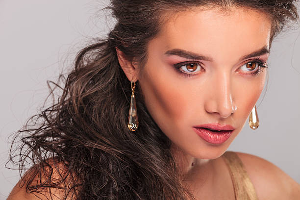 istock close up with curly brunette looking away 582283646