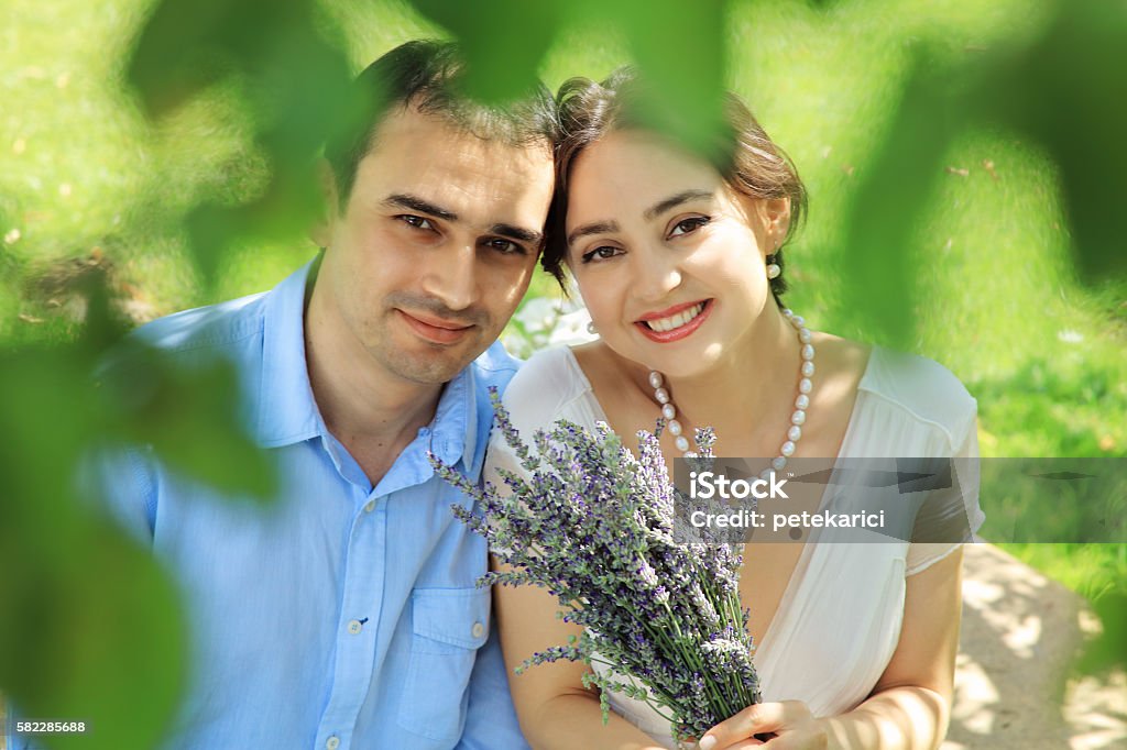 Bride and groom in a garden 20-24 Years Stock Photo