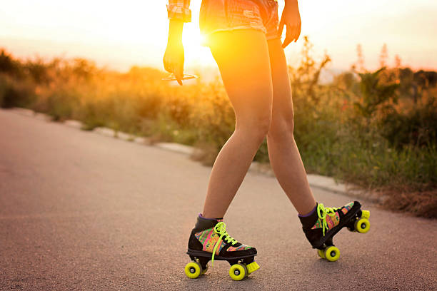 istock Closeup, human legs driving roller skates 582287368