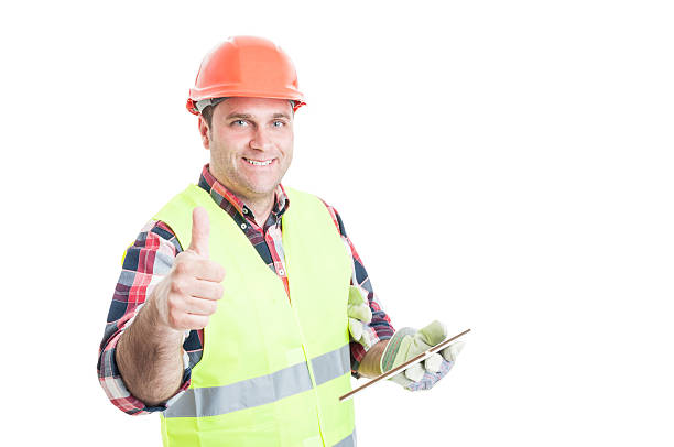 istock Happy builder holding tablet and showing thumbup 582288262