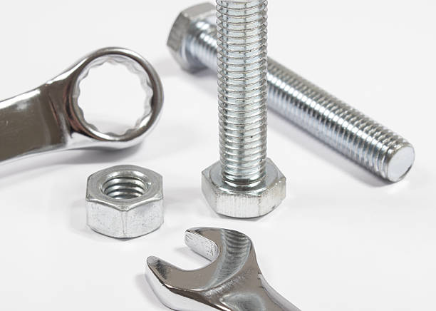 istock Screw, nut, wrench isolated on white 582288988