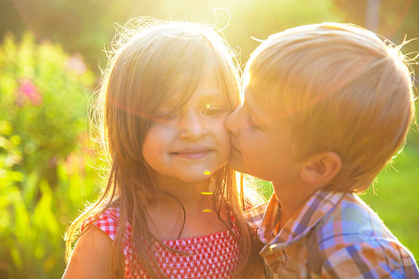istock Shildren kissing 582289416