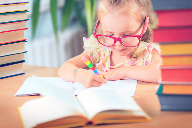 istock Kid  Reading Book, Pupil Learn Lesson and Dream, Education 582290070