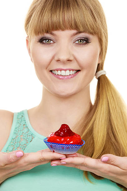 istock Woman holds cake strawberry cupcake 582291178