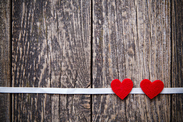 Brown wooden background with red hearts witout text. Wooden background with red hearts on Valentine's day. witout stock pictures, royalty-free photos & images