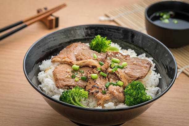 istock Roasted pork with stir fried broccoli and japanese rice 582296250
