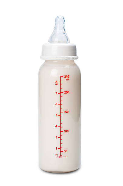 istock Baby bottle with milk for boy. Isolated on white background 582296358