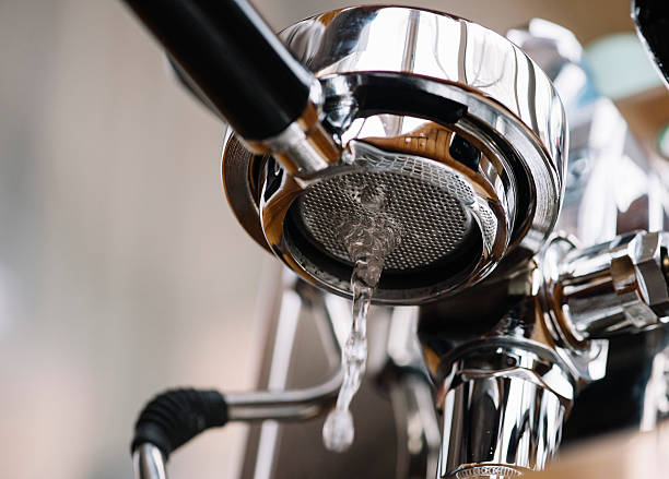 Maintenance of the espresso machine's group: basic water cleaning stock photo