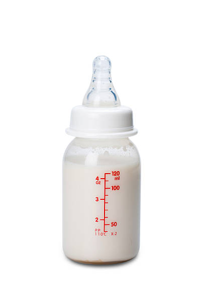 istock Baby bottle with milk for boy. Isolated on white background 582296514