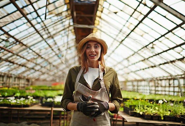 istock Girl in green-house 582296644