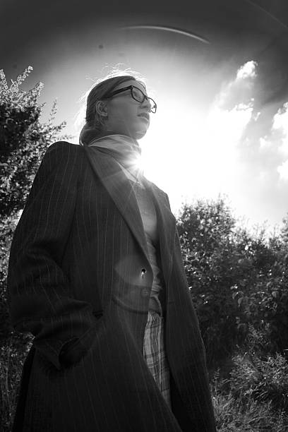 istock girl in glasses against dramatic sky 582298074