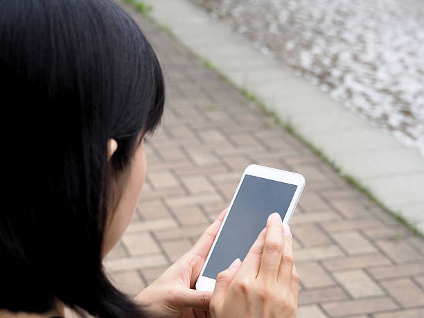 istock Lady Is Watching The Screen Of Her Smartphone 582300324