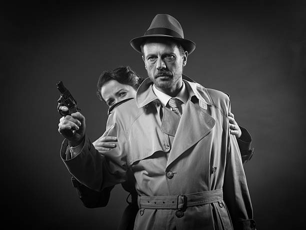 Thriller film noir scene with man pointing a gun and woman hiding behind him