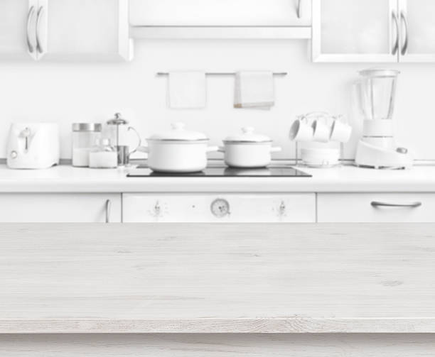 istock Wooden table on white modern kitchen interior background, pastel colors 582302232