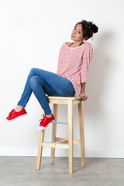 istock smiling young female student posing with sexy attitude in summertime 582303970