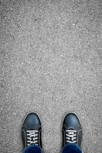 istock Black casual shoes standing on the road 582305870