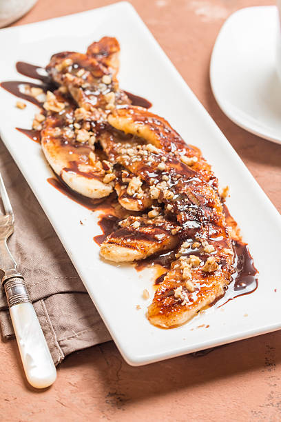istock Grilled banana with chocolate sauce 582307284