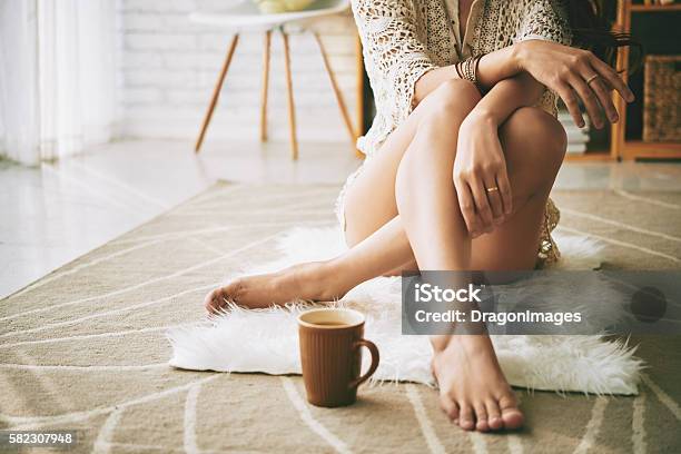 Resting On Floor Stock Photo - Download Image Now - Women, One Woman Only, Fashion