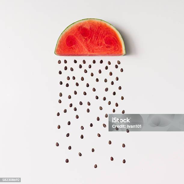 Watermellon Slice With Seeds Raining Stock Photo - Download Image Now - Flat Lay, Square - Composition, Creativity