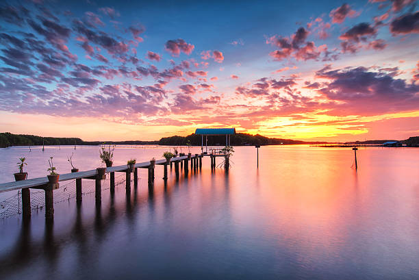 istock Bamboo bridge in the sea the twilight 582309432