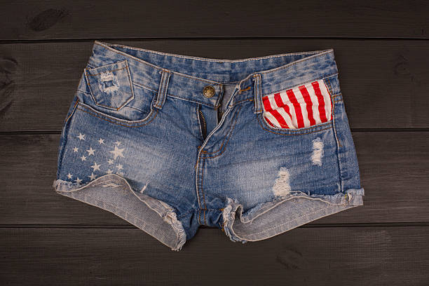 istock Jeans shorts in wood background 582309584