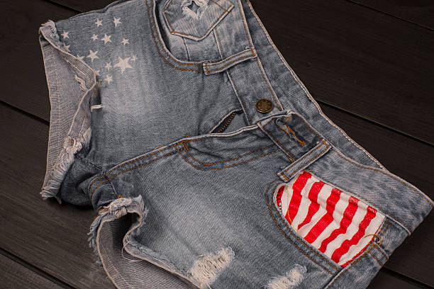 istock Jeans shorts in wood background 582310182