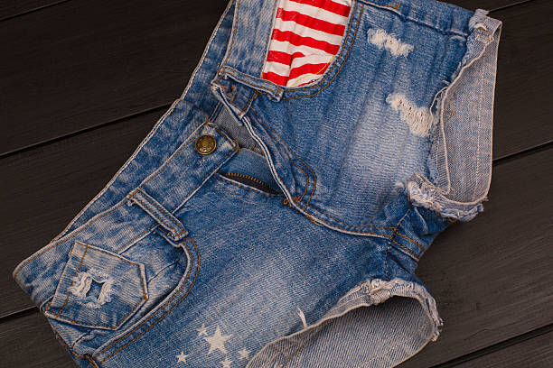istock Jeans shorts in wood background 582310340