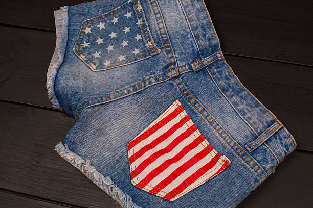 istock Jeans shorts in wood background 582310840