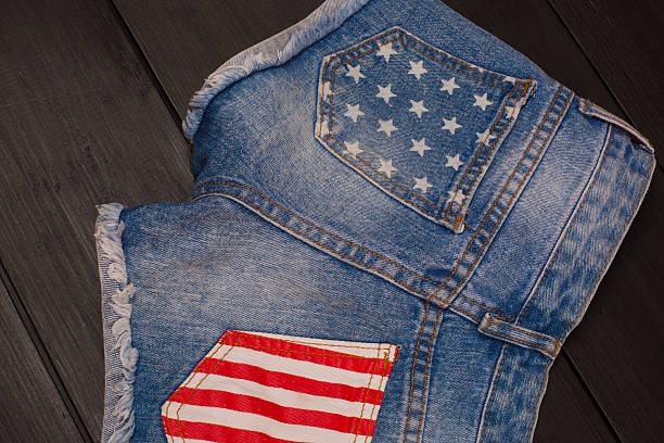 istock Jeans shorts in wood background 582311084