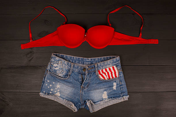 istock Woman's brassiere top and jeans shorts. 582311252