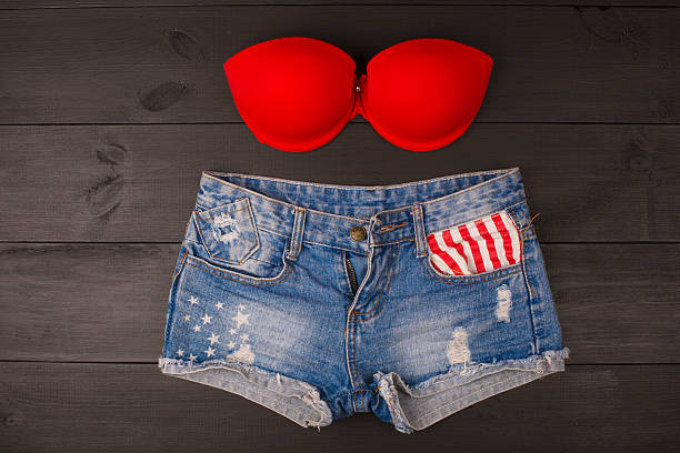 Woman's brassiere top and jeans shorts.