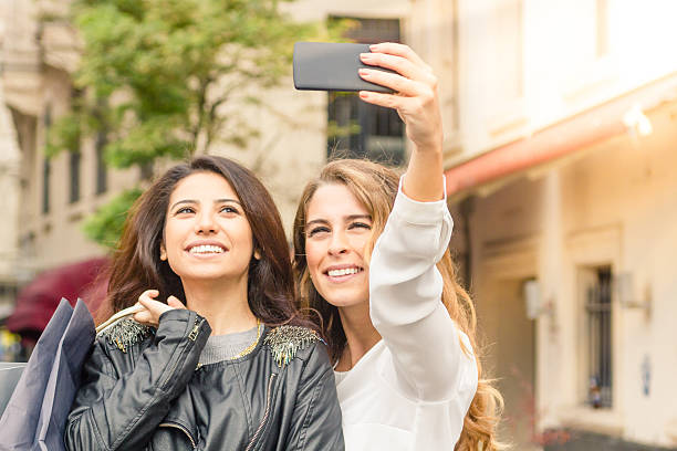 istock best friends taking a selfie 582313722