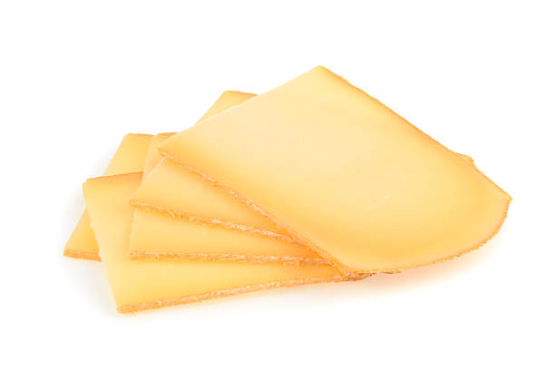 раклетт сыр, изолированные на белом фоне - raclette cheese стоковые фото и изображения