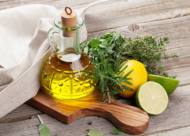 istock Olive oil and fresh garden herbs 582315598