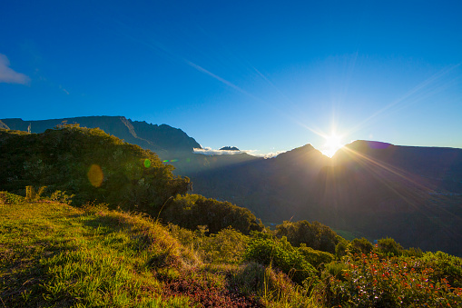 Salazie Cirque during the sunset, Reunion Island. Hell-Bourg in the valley and Piton de Neiges in the left part of the image Tallest mountain in Reunion.