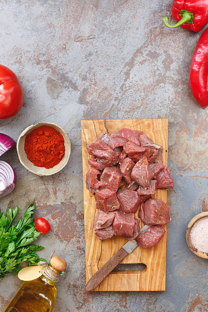 istock Raw meat and fresh ingredients for cooking 582317762
