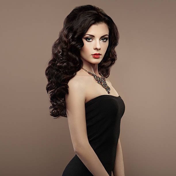 istock Brunette woman with curly hairstyle 583689224