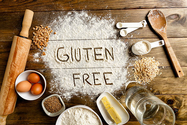 istock Gluten free bread ingredients and utensils on wood frame background 583690046