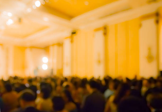 istock blur  clouded customers in hotel ballroom at night 583690952
