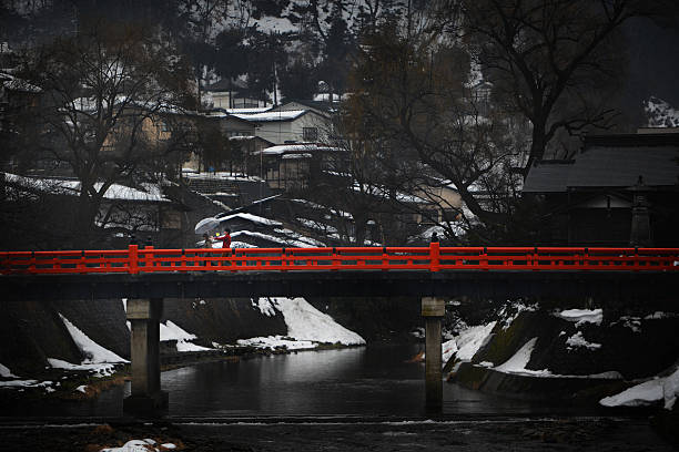 Takayama, Japan - February 4, 2013: TAKAYAMA, JAPAN - February 4, 2013 : Landmark of Takayama, Nakabashi red bridge at Takayama is old town which is register as world heritage site.